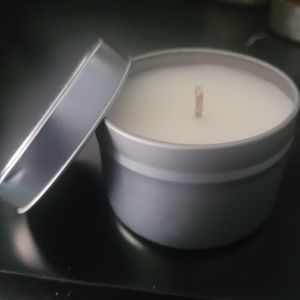 4 oz travel tin pumpkin chai candle .  25 hr burn time